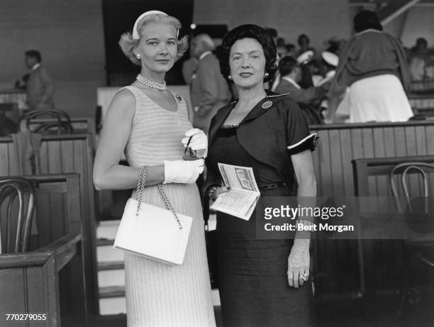 American socialite Mrs. Winston F. C. Guest with Mrs Stephen Sanford, in a private box at Saratoga Race Course, Saratoga Springs, New York, 1953.