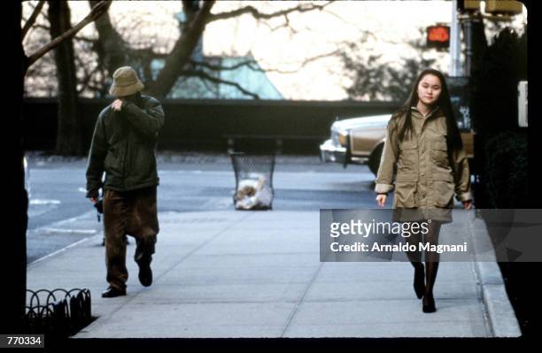 Director Woody Allen walks with girlfriend Soon Yi Previn January 23, 1993 in New York City. Allen's ex-girlfriend Mia Farrow is filing for custody...