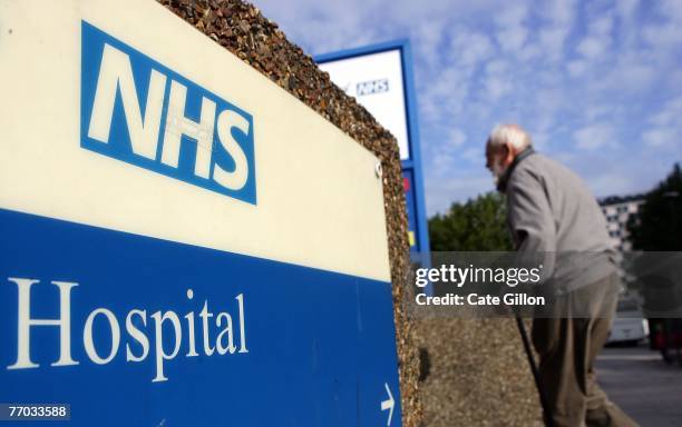 An elderly gentleman walks past a hospital sign on September 26, 2007 in London, England. In a report to be released September 27, 2007 the...