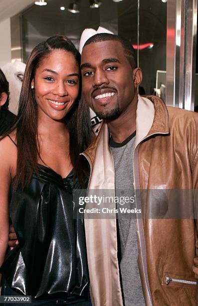 Alexis Pheiffer, left, and music recording artist Kanye West attend the grand opening of Intermix on September 25, 2007 in Los Angeles, California.