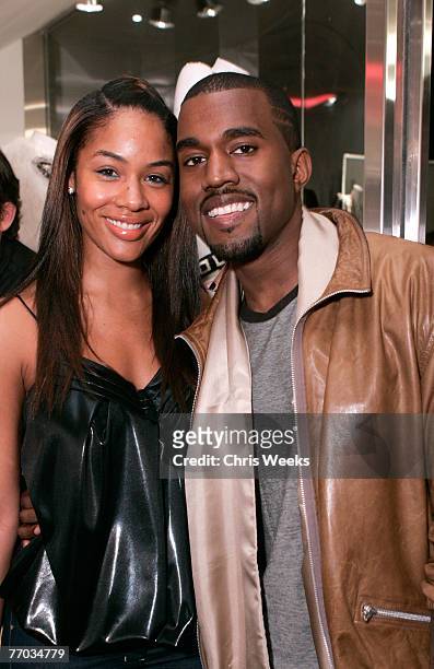 Alexis Pheiffer, left, and music recording artist Kanye West attend the grand opening of Intermix on September 25, 2007 in Los Angeles, California.