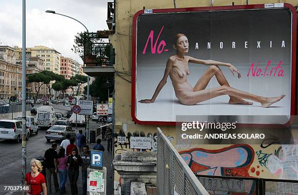 This picture taken 26 September 2007 in Rome shows an Italian advertising campaign featuring French actress and anorexia sufferer Isabelle Caro,...