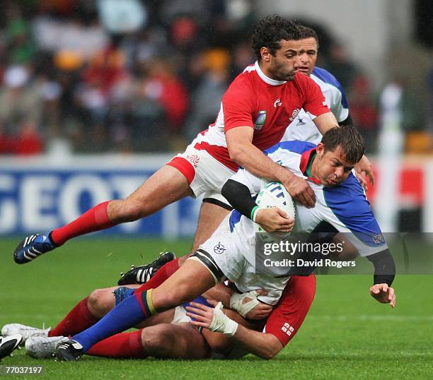 Jacques Nieuwenhuis of Namibia is tackled by Merab Kvirikashvili of Georgia during the Rugby World Cup 2007 Pool C match between Georgia and Namibia...