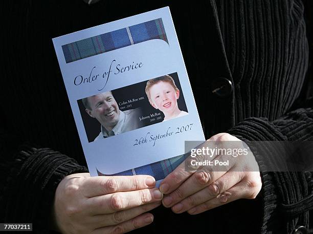 Mourner holds the order of service for the funeral of Colin McRae and his son Johnny outside at EastChapel, Daldowie Crematorium on September 26,...