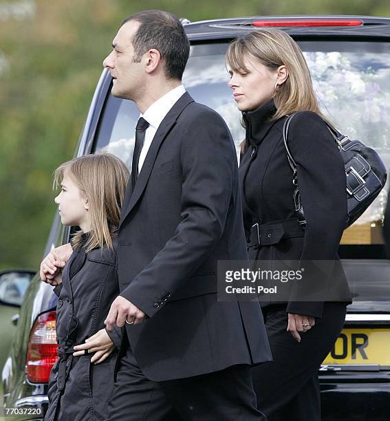 Mark Porcelli, father of Ben Porcelli who was killed in a helicopter crash and family, arrive for the funeral of Colin McRae and son Johnny at East...