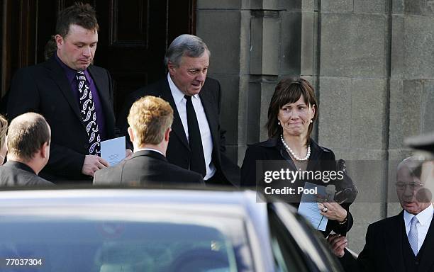 Jimmy McRae, father of Colin McRae and Alison McRae, wife of Colin McRae leave the funeral of Colin McRae and son Johnny at East Chapel, Daldowie...