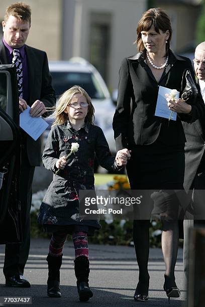 Alison McRae, wife of Colin McRae and daughter Holly leave the funeral of Colin McRae and son Johnny at Eastt Chapel, Daldowie Crematorium on...