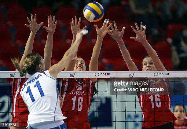German's Kathleen Weiss , Corina Ssuchke and Margareta Kozuch and Russian Ekaterina Gamova in action during Volleyball game German vs Russia, in the...
