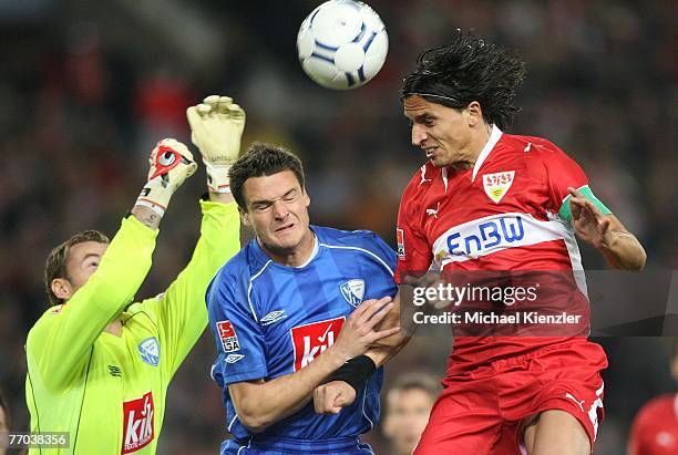 Fernando Meira of Stuttgart challenges Jan Lastuvka and Marcel Maltritz of Bochum during the Bundesliga match between VfB Stuttgart and VfL Bochum at...