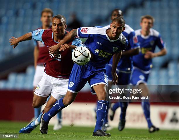 Gabriel Agbonlahor of Aston Villa is challenged by Partrick Kisnorbo of Leicester during the Carling Cup tie between Aston Villa and Leicester City...