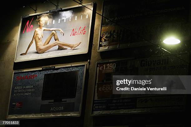 Billboard reading "No Anorexia" shows an Italian advertising campaign featuring French comedian and anorexia sufferer Isabelle Caro photographed by...