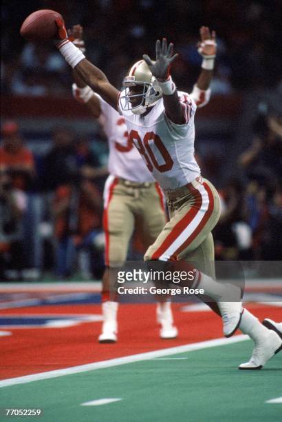 Wide receiver Jerry Rice of the San Francisco 49ers celebrates on his way to the end zone for a touchdown in Super Bowl XXIV against the Denver...