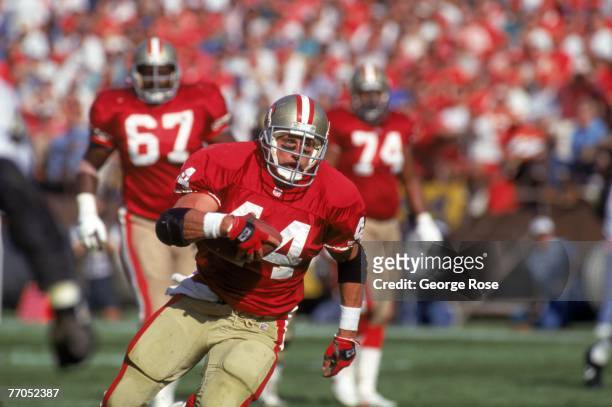 Full back Tom Rathman of the San Francisco 49ers runs with the ball during a game against the New Orleans Saints at Candlestick Park on November 15,...
