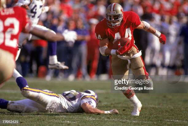 Full back Tom Rathman of the San Francisco 49ers runs with the ball during the 1989 NFC Divisional Playoff game against the Minnesota Vikings at...
