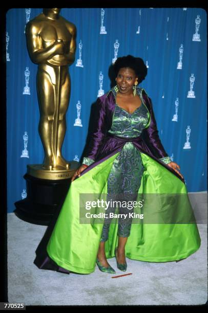 Whoopi Goldberg stands at the 65th annual Academy Awards March 29, 1993 in Los Angeles, CA. The Academy Awards are given to outstanding individuals...