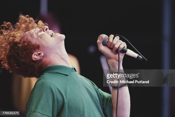 Singer Mick Hucknall performs live with Simply Red on the Pyramid Stage at the Glastonbury Festival near Pilton, Somerset, 22nd June 1986.