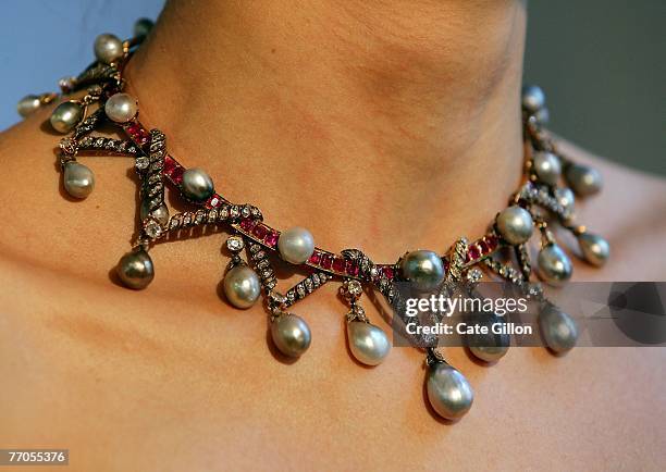 Marie Antoinette's necklace is modelled at Christie's London on September 27, 2007 in London, England. The pearl, diamond and ruby necklace is...
