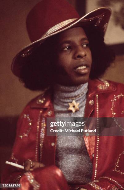 Sly Stone of Sly And The Family Stone posed smoking a cigarette in London on 16th July 1973.