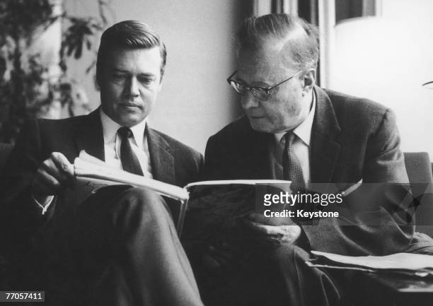 Austrian actor Karlheinz Bohm with his father, orchestral conductor Karl Bohm studying the score of the opera 'Elektra' by Richard Strauss, 22nd...
