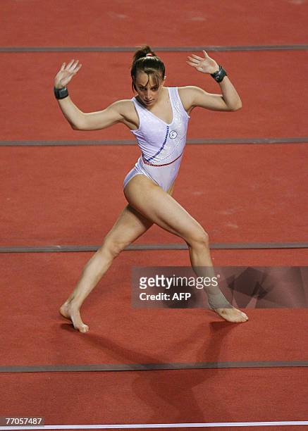 - Emilie Le Pennec of France competes in floor exercices during the World Cup Gymnastics's final at Gent's topsporthal, 13 May 2007, in Belgium....