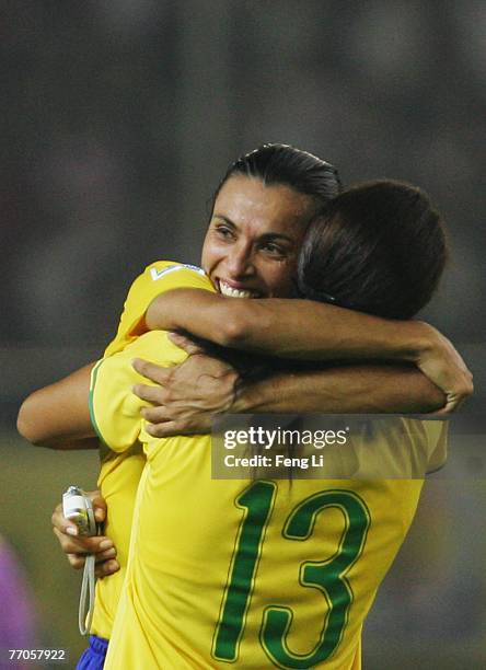 Marta of Brazil celebrates the winning with Monica after the Womens World Cup 2007 Semi Final match between USA and Brazil at Hangzhou Dragon Stadium...