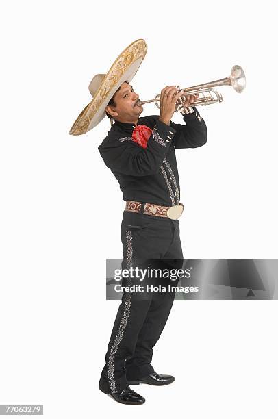 portrait of mariachi playing trumpet - mariachi stock pictures, royalty-free photos & images