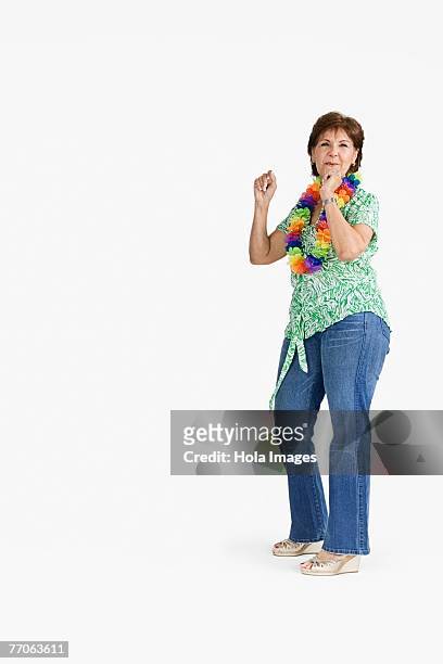side profile of a senior woman dancing - hawaiian shirt imagens e fotografias de stock