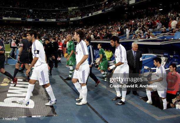 Real Madrid players Raul Gonzales, Sergio Ramos, Miguel Torres, Javier Saviola and Iker Casillas get into the field before the La Liga match between...