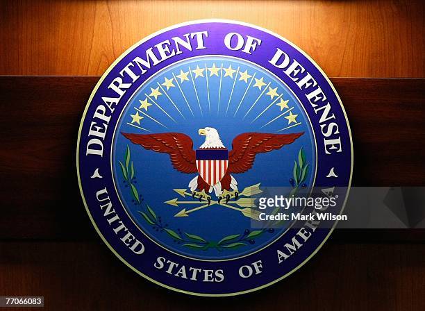 Light shines on the seal of the Department of Defense during a briefing at the Pentagon, September 27, 2007 in Arlington, Virginia. Today was...