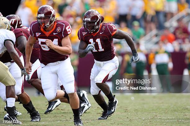 Linebacker Xavier Adibi of the Virginia Tech University Hokies gets ready to make a tackle against the College of William & Mary Tribe on September...