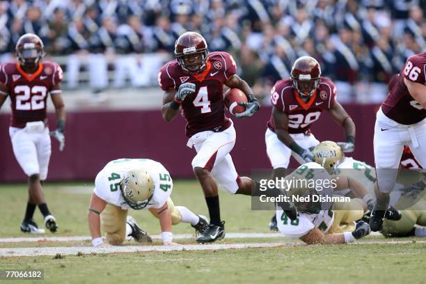 Wide receiver Eddie Royal of the Virginia Tech University Hokies runs with the ball after a catch from a punt against the College of William & Mary...