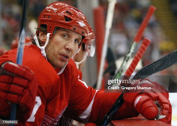 Dallas Drake of the Detroit Red Wings looks on from the bench during the first period against the Tampa Bay Lightning during a preseason game...
