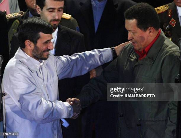 Venezuelan president Hugo Chavez and his Iranian counterpart Mahmoud Ahmadinejad shake hands 27 September at the Miraflores presidential palace in...