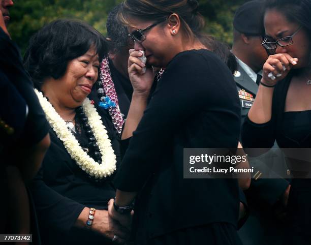 Regina Gagalac mother of Sgt. Alexander Udarbe Gagalac comforts her during her son'ss burial at the National Memorial Cemetery of the Pacific,...