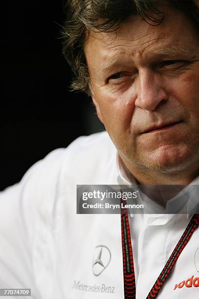Norbert Haug of Mercedes Benz Motorsport is seen in the paddock during practice for the Japanese Formula One Grand Prix at the Fuji Speedway on...