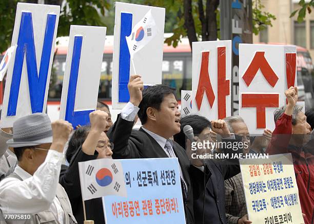 South Korean protesters and North Korean defectors shout slogans during an anti-North Korea rally in Seoul, 28 September 2007, against a planned...