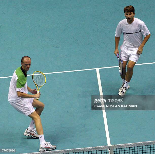 Petr Pala and David Skoch of the Czech Republic in action against the Thai's twin Sanchat Ratiwatana and Sanchai Ratiwatana during their doubles...
