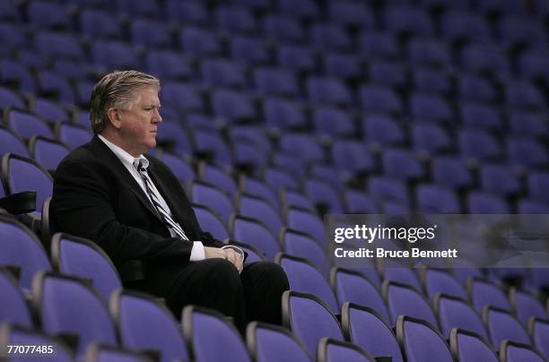 Brian Burke, executive vice president and general manager of the Anaheim Ducks watches a practice session for the Los Angeles Kings and the Anaheim...