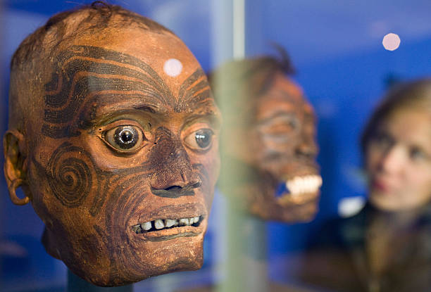 Museum worker looks at mummified heads with tattoos at the "Mummies - The Dream of Everlasting Life" exhibition at the Reiss-Engelhorn Museum in...
