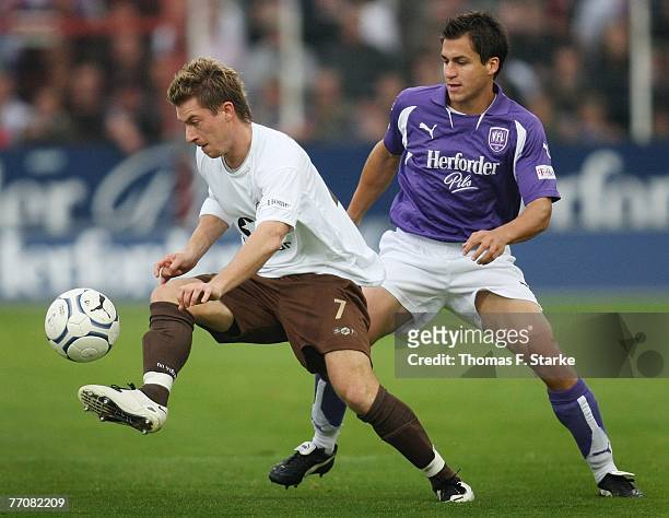 Marvin Braun of St. Pauli and Andreas Schaefer of Osnabrueck tackle for the ball during the 2nd Bundesliga match between VfL Osnabruck and FC St....