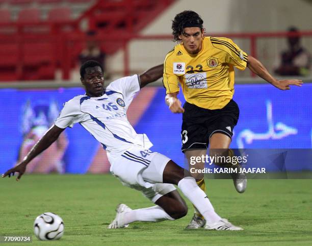 Qatar club player Sebastian Soria vies with Al-Sailiya club player Maboulo Baba Keita during their Qatari championship football match in Doha 28,...