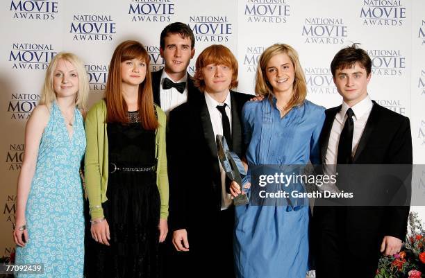 Actors Evanna Lynch, Bonnie Wright, Matthew Lewis, Rupert Grint, Emma Watson and Daniel Radcliffe pose in the awards room with the Best Family Film...