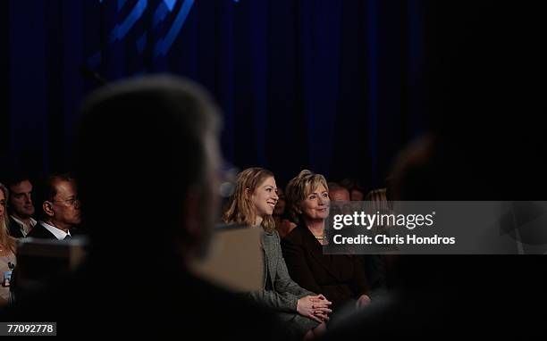 Presidential candidate Hillary Clinton and Chelsea Clinton look on as Bill Clinton gives the ending address on the final day of the Clinton Global...