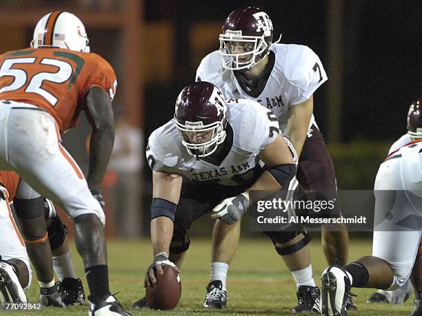 Quarterback Stephen McGee of Texas A&M Aggies lines up behind center Cody Wallace against the University of Miami Hurricanes at the Orange Bowl on...