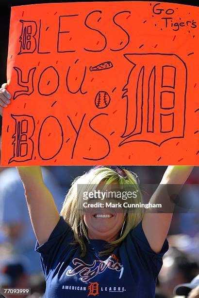 Female Detroit Tigers fan holds up a sign to show her support during the game against the Kansas City Royals at Comerica Park in Detroit, Michigan on...