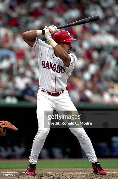 Juan Gonzalez of the Texas Rangers batting during a MLB game against the Colorado Rockies on July 3, 1997 in Arlington, Texas.