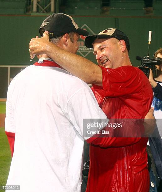 Manager Terry Francona of the Boston Red Sox celebrates with Tim Wakefield after they defeated the Minnesota Twins 5-2 and the New York Yankees lost...