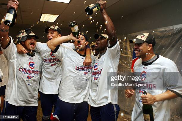 Chicago Cubs players celebrate winning the National League Central Division after they defeated the Cincinnati Reds 6-0 at Great American Ballpark...