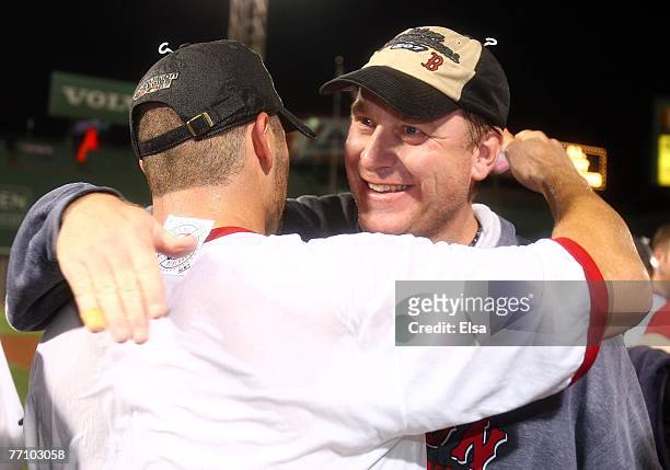 Kurt Schilling and Jason Varitek of the Boston Red Sox celebrate after the Red Sox defeated the Minnesota Twins 5-2 and the New York Yankees lost to...