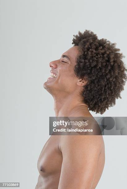 mixed race man with bare chest - mixed race man standing studio stockfoto's en -beelden